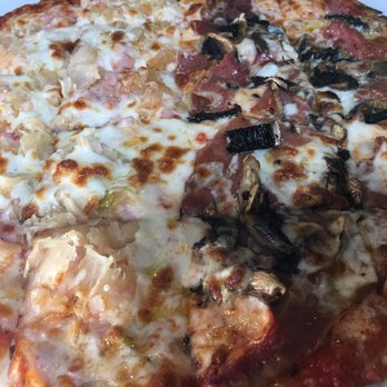 Treehouse Pub & Eatery - Mix and match, or try one of their creations. Half Canadian bacon and sauerkraut / half prosciutto and mushroom. - Pizza Near Me - Bettendorf, Iowa