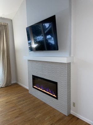Modern Fireplace Build - This customer always wanted a fireplace to sit in front and drink tea in the evenings. They showed me a picture off Pinterest and quickly we got to work. It took us a little over a week because we had to order in the tile and TV mount but the result was exactly as the homeowner imagined. Glad we could satisfy her to the full extent Modern Fireplace Build - This customer always wanted a fireplace to sit in front and drink tea in the evenings. They showed me a picture off Pinterest and quickly we got to work. It took us a little over a week because we had to order in the tile and TV mount but the result was exactly as the homeowner imagined. Glad we could satisfy her to the full extent