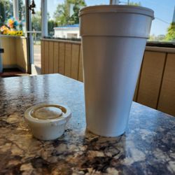 Sunrise Biscuit - Funny comparison on my lg coffee and side of gravy! But I'm giggling. Tiny lil gravy in NC. Where's Chipped Beef?