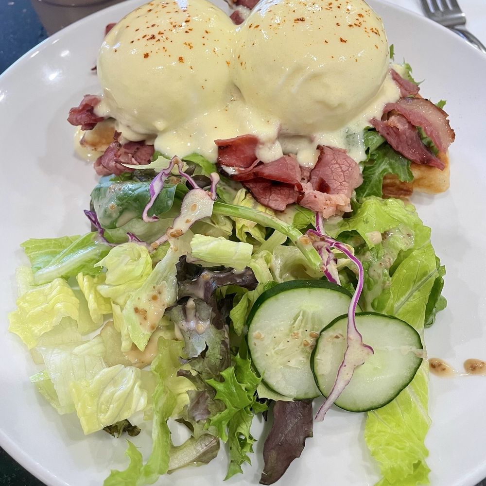 Beef pastrami mochi waffle eggs Benedict with salad. Beef pastrami mochi waffle eggs Benedict with salad.