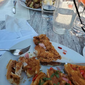 151 Kitchen | Bar - Chicken & Waffles, across is the crispy chicken Benedict with side of potatoes. - Cocktail Bars Near Me - Elmhurst, Illinois