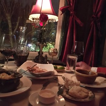 Bistro Cacao - Intimate table against bay window overlooking the street. It has a privacy curtain which makes it even more romantic! - French Near Me - Washington, DC, District of Columbia