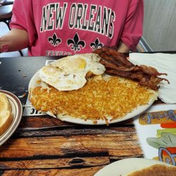 Bleus Family Dining - Two eggs, bacon, hash browns and toast.
