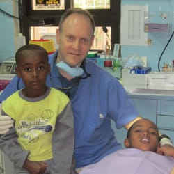 Scott M. Dubowsky, DMD - Dr. Dubowsky with Ethiopian children at the DVI clinic in Jerusalem.