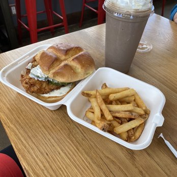 Flip The Bird Danvers - A fried chicken sandwich with a bun, fried chicken, and toppings, served with French fries and a chocolate milkshake topped with whipped cream. - Chicken Shop Near Me - Danvers, Massachusetts
