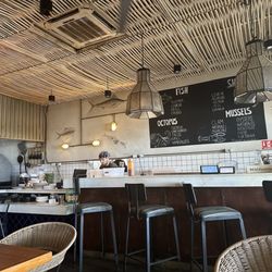 Buzos Del Cabo - Inside view of the counter and showing a pizza oven to the left side.