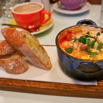 Hardware Societe - Baked Eggs with Chorizo Sausage, Piquillo Pimento Sauce, Crunchy Almonds, and Queso de Cabra Goats Milk Cheese - Breakfast & Brunch Near Me - Melbourne, VIC Hardware Societe - Baked Eggs with Chorizo Sausage, Piquillo Pimento Sauce, Crunchy Almonds, and Queso de Cabra Goats Milk Cheese - Breakfast & Brunch Near Me - Melbourne, VIC