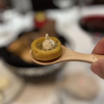 High Steaks - a hand holding a wooden spoon with a piece of food on it - Steakhouses Near Me - Lincoln, California High Steaks - a hand holding a wooden spoon with a piece of food on it - Steakhouses Near Me - Lincoln, California