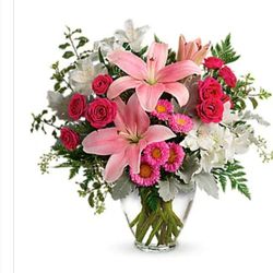 Thompson Country Florist - What I got and what I ordered. I ordered a professional bouquet like in the picture. I got a very amateurish bouquet with a ton of filler.