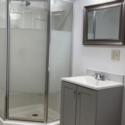 Alcantar Construction - Renovated and installed new vanity sink, shower, flooring, and toilet.
