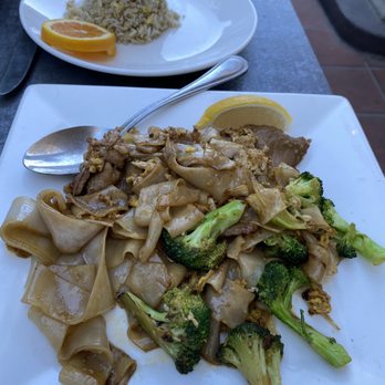 Le Basil - I think he said pad see noodles with pork and fried rice. So yummy - Thai Near Me - Palm Desert, California Le Basil - I think he said pad see noodles with pork and fried rice. So yummy - Thai Near Me - Palm Desert, California