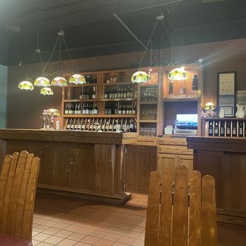 Tasting Devine - a bar with a lot of bottles of wine - Wine Tasting Room Near Me - Wheaton, Illinois
