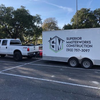 Superior Masterworks - a truck and trailer in a parking lot - General Contractors Near Me