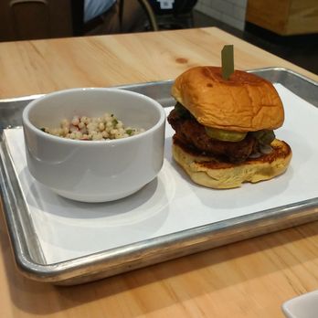 Bellwether - Fried Chicken thigh sandwich with couscous - Cocktail Bars Near Me - Jacksonville, Florida