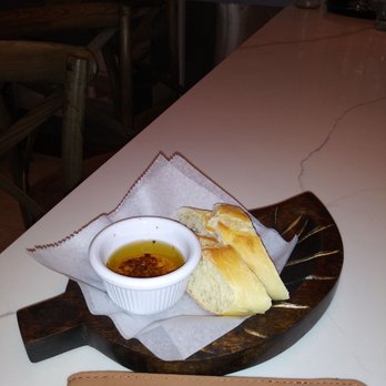 The Shell Restaurant - Bread warmed up served with a sause - Seafood Near Me - New York, New York
