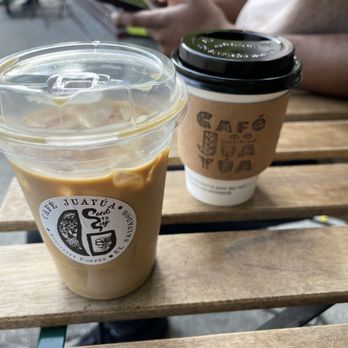 Cafe Juayua - Iced vanilla oat latte and a hot coffee with a splash of oat milk - Coffee & Tea Near Me - Los Angeles, California