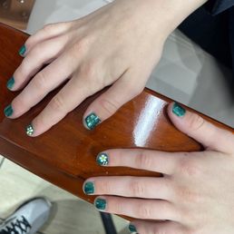 They painted my daughter's nails and put really pretty little flowers on them looks like daisies!
