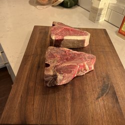 Hickman's Meat Market - 65 day dry aged porterhouse steaks cooked in the wood fired pizza oven