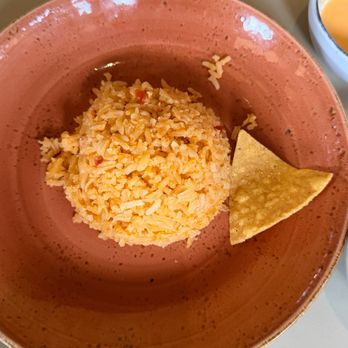 Javiers - Side of rice. I placed a chip beside it for size comparison. - New Mexican Cuisine Near Me - Pasadena, California