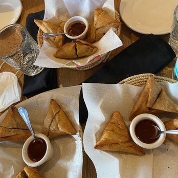 Demera - Chicken, lentil and spinach sambusas with sweet and spicy honey awaze sauce - Ethiopian Near Me - Chicago, Illinois Demera - Chicken, lentil and spinach sambusas with sweet and spicy honey awaze sauce - Ethiopian Near Me - Chicago, Illinois