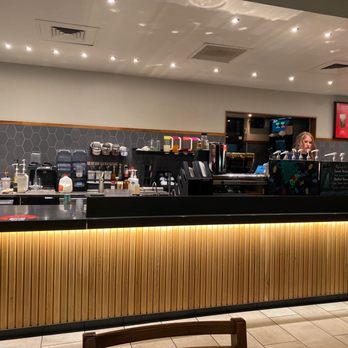 Starbucks - a woman behind the counter of a coffee shop - Coffee & Tea Near Me - Lubbock, Texas Starbucks - a woman behind the counter of a coffee shop - Coffee & Tea Near Me - Lubbock, Texas