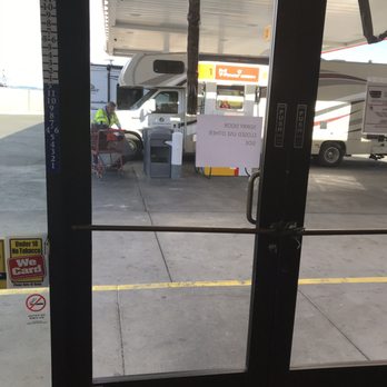Shell - This entrance/exit was tied shut.  Safety hazard.  Only one set of doors for all to enter/exit.  Fire marshal should be notified. - Gas Stations Near Me - Fabens, Texas