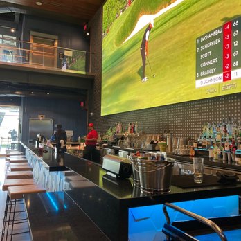 Topgolf - Photo of the bar and the giant bar screen. - Golf Near Me - El Segundo, California Topgolf - Photo of the bar and the giant bar screen. - Golf Near Me - El Segundo, California
