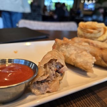 Burtons Grill & Bar - Cheesesteak Spring Rolls w/ spicy ketchup - New American Near Me - Huntersville, North Carolina Burtons Grill & Bar - Cheesesteak Spring Rolls w/ spicy ketchup - New American Near Me - Huntersville, North Carolina