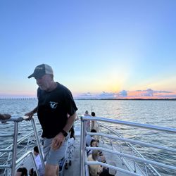 Frisky Mermaid Dolphin Cruises & Pontoon Boat Rentals - Captain Steve working his Okie Tail off.