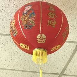 a red lantern hanging from the ceiling a red lantern hanging from the ceiling