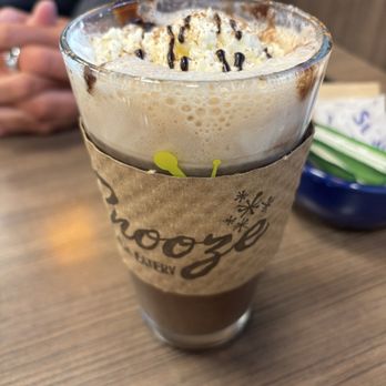 Snooze, an A.M. Eatery - Hot chocolate. $1 extra for a plant based milk, and also they put cinnamon on it which was not mentioned in the description. - Breakfast & Brunch Near Me - Buford, Georgia Snooze, an A.M. Eatery - Hot chocolate. $1 extra for a plant based milk, and also they put cinnamon on it which was not mentioned in the description. - Breakfast & Brunch Near Me - Buford, Georgia
