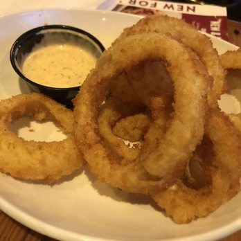 Miller's Ale House - Their onion rings are really good. The sauce they give is a perfect dip for them. - Sports Bars Near Me - Lake Grove, New York
