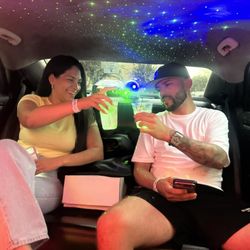 Parents, in the limo, celebrating after a very successful birthday party