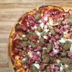 Aviator Pizza & Drafthouse - The Meat Almighty. Pit Smoked Ham, Ground Beef, Bacon, & Italian Sausage.