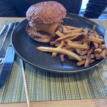 Poke The Bear - $16 Cheeseburger & cold fries. Check out the bun to burger ratio. - New American Near Me - Green Bay, Wisconsin