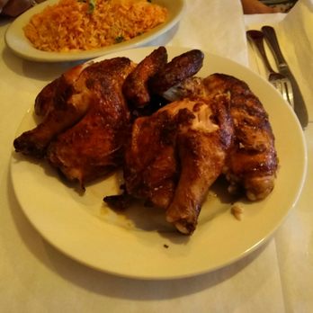 Don Alex - Roast chicken with rice in background - Peruvian Near Me - Rego Park, New York Don Alex - Roast chicken with rice in background - Peruvian Near Me - Rego Park, New York