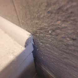 ServiceMaster Restoration by Jouny - No sanded edges. No pre-painted trim anywhere. This being a wet surface, all this wood is going to rot because it's unprotected.