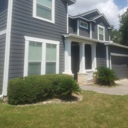 Fresh Coat Painters of Schertz - Exterior Painting project in Cibolo in Peppercorn, White, and Rockwood Red on the front door.