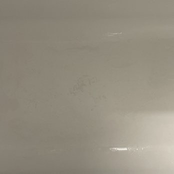 B LaGrassa Construction - Grout embedded into tub - General Contractors Near Me