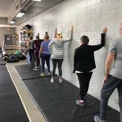 Masters class doing some cool down stretching.
