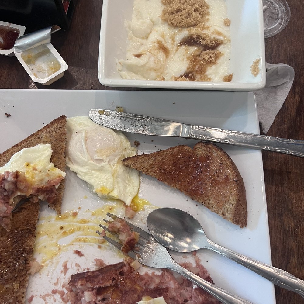 Olympic Taverna - Eggs over medium with corned beef hash. Grits with brown sugar. Yum - Greek Near Me - Palm City, Florida Olympic Taverna - Eggs over medium with corned beef hash. Grits with brown sugar. Yum - Greek Near Me - Palm City, Florida