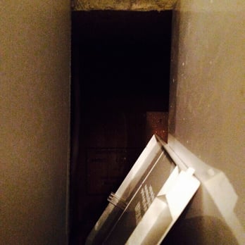 Chateau Orleans - Cut out behind the microwave  that exposes the inside of wall - Hotels Near Me - New Orleans, Louisiana