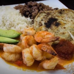Faro Del Pacifico Pupuseria & Restaurant - Pupusas with pickled slaw(curtido), shrimp in tomato sauce, avocado and rice. Delicious.