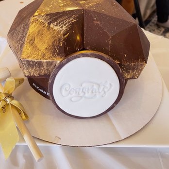 Ji's Cake Boutique - Cake shelled in hardened chocolate that had to be broken with the hammer she provided. - Cupcakes Near Me Ji's Cake Boutique - Cake shelled in hardened chocolate that had to be broken with the hammer she provided. - Cupcakes Near Me