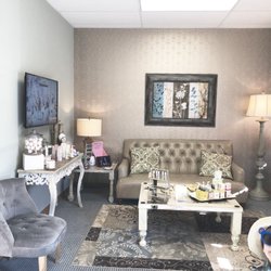 Dermadorn - Waiting area with testers, snacks, bath bombs, comfortable seating andTV