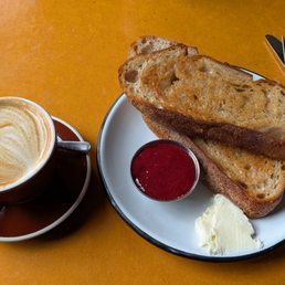 Flat white and toast & jam with whipped butter