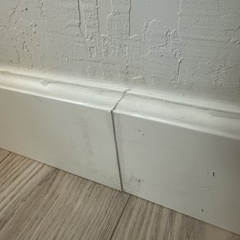Empire Today - Baseboard seams with glue smudges - Carpet Installation Near Me