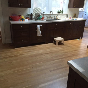 Beck Hardwood Floors - a kitchen with a sink and a window - Flooring Near Me Beck Hardwood Floors - a kitchen with a sink and a window - Flooring Near Me