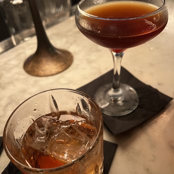Black Hound Bar & Lounge - a glass of alcohol and a drink - Lounges Near Me - New York, New York