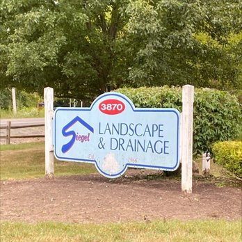 Siegel Landscape & Drainage - a sign for a landscape and drainage company - Landscaping Near Me - Buffalo, New York Siegel Landscape & Drainage - a sign for a landscape and drainage company - Landscaping Near Me - Buffalo, New York